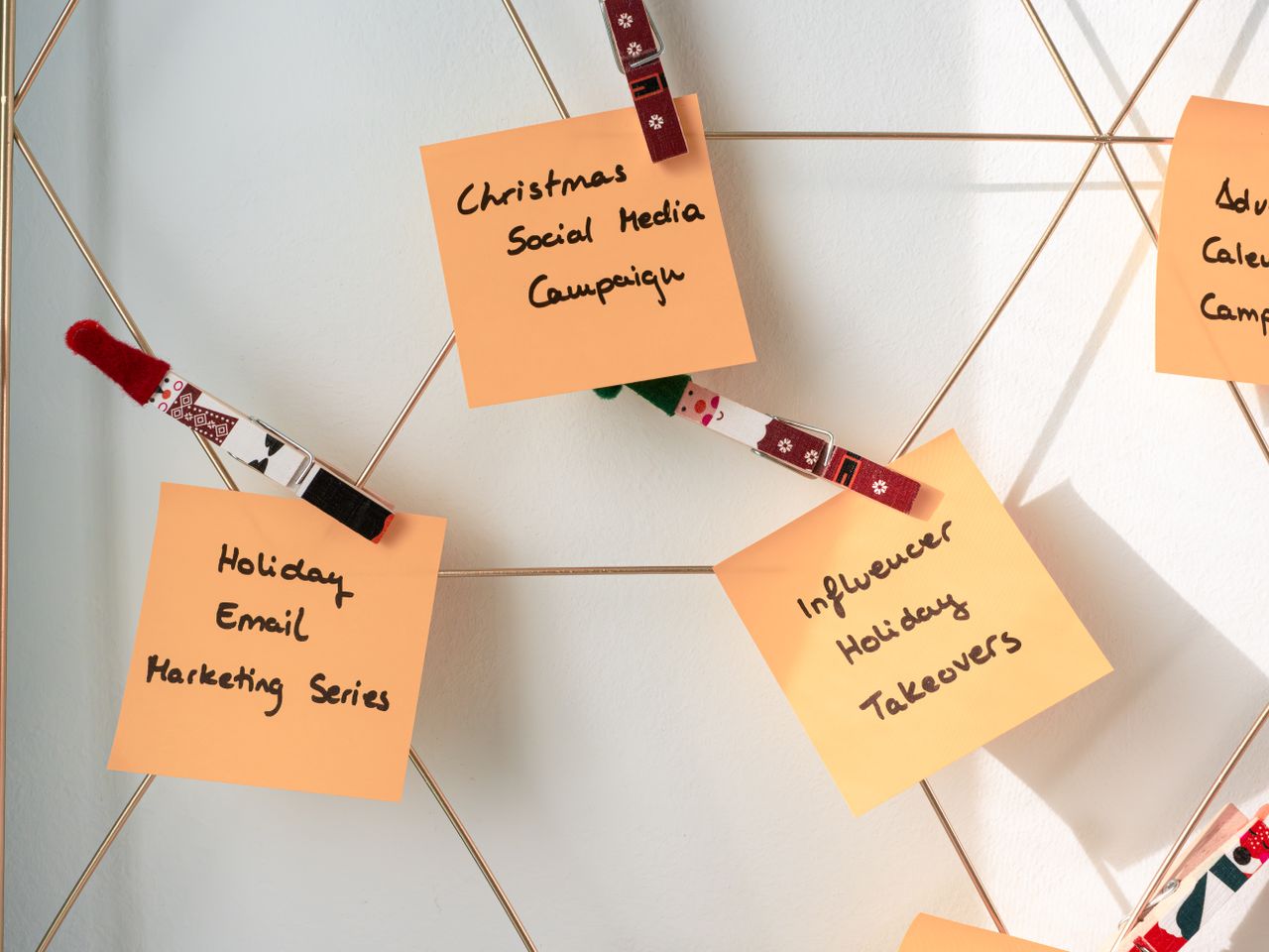 services-03 Sticky notes with holiday marketing ideas for Christmas social media and email campaigns.